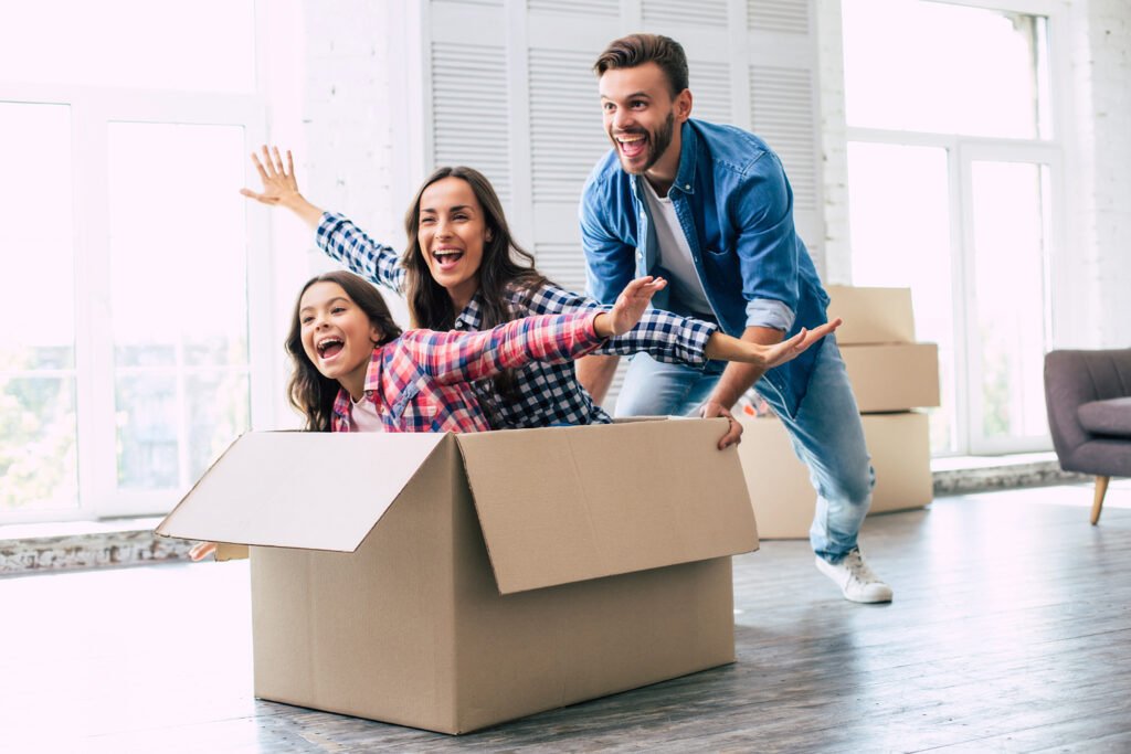 HAPPY SELLERS AT CLOSING NORTH ALABAMA — SMILING COUPLE AT TITLE COMPANY AFTER SUCCESSFUL HOME SALE