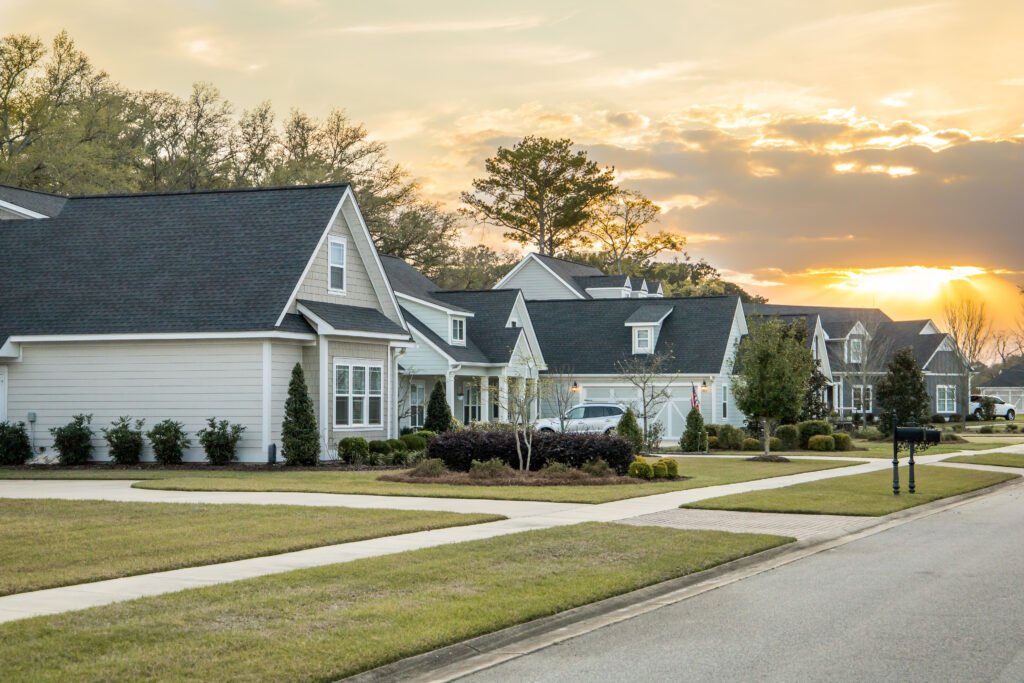 HUNTSVILLE NEIGHBORHOOD EXTERIOR PHOTO — TREE-LINED NORTH ALABAMA RESIDENTIAL STREET AT GOLDEN HOUR