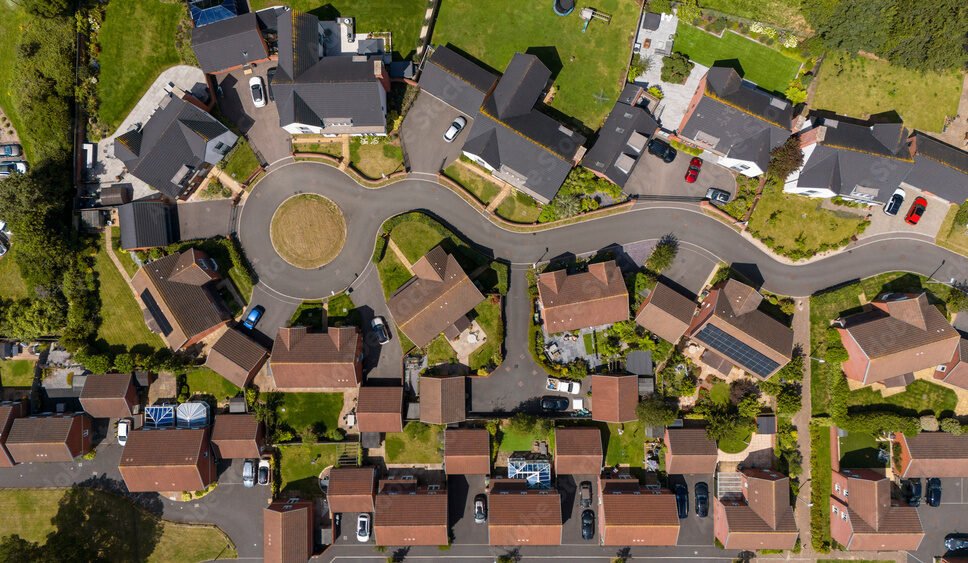 Aerial view of a picturesque suburban neighborhood with modern homes and organized streets, Exeter, United Kingdom.